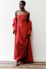 Load image into Gallery viewer, Unleash your daring side with the Caravaggio Dress Rouge by STAUD! This luxurious maxi dress, crafted from a silk wool blend, drapes elegantly and offers structural support with its built-in corset. Perfect for any adventure, this dress combines ease and sophistication. Embrace the challenge and stand out in style!
