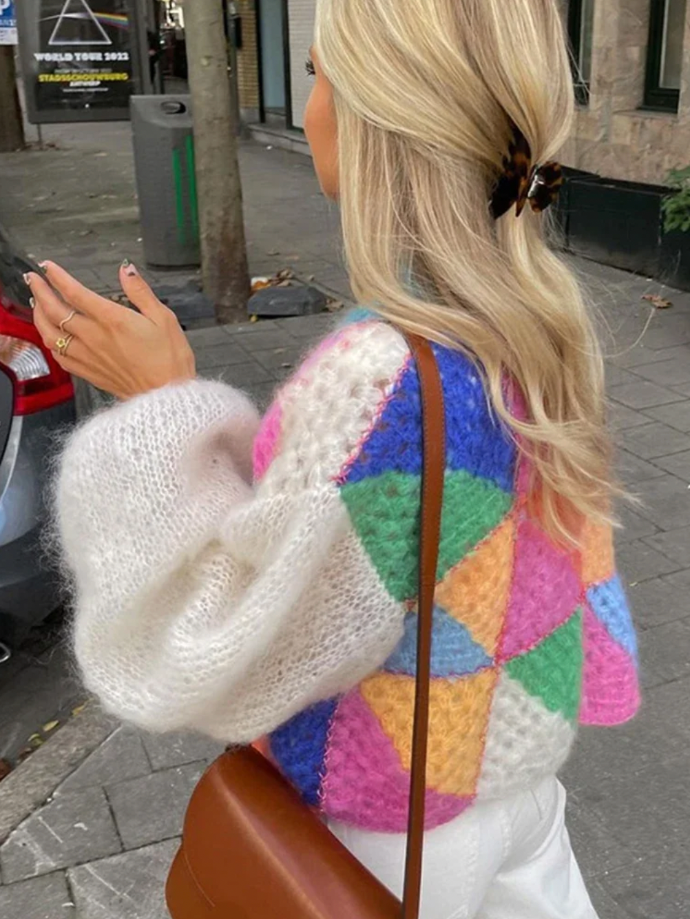 Introducing the Cardigan Sophie, a must-have addition to your wardrobe. This vibrant patchwork design boasts lantern sleeves, O neck, and a loose knitwear fit. Made with high-quality materials and detailed crochet work, this cardigan offers both fashion and comfort. Elevate your style with this chic and versatile piece.