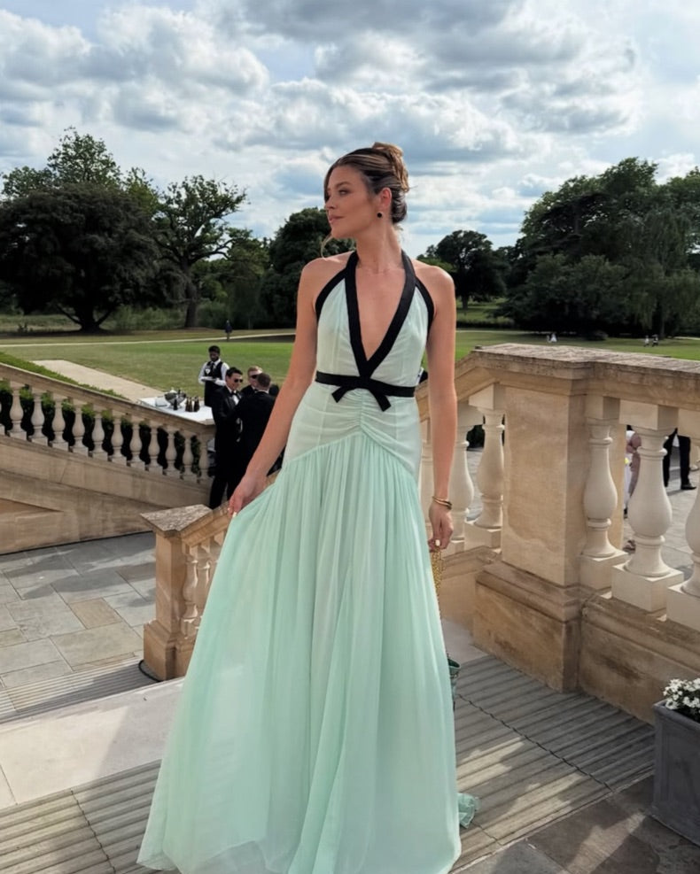 The Siren Dress in Mint by Helsa is engineered for those who embrace bold fashion statements. This sleeveless bodycon maxi features a striking plunging V-neckline and open back that exude confidence and allure. Contrast mesh patchwork adds contemporary visual interest, while pleated skirt detailing creates graceful movement. The secure halter construction delivers support without compromising the dress's daring aesthetic. 