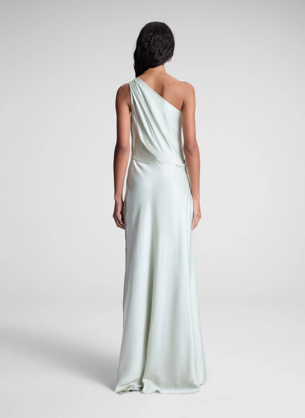 The Aster Satin One Shoulder Gown by A.L.C in radiant chartreuse offers a stunning blend of elegance and modern design. Crafted from smooth satin, it features a graceful one-shoulder cut that flows beautifully over the body. Soft pleats at the shoulder and waist sculpt the silhouette, while the asymmetrical design enhances movement and visual interest. Perfect for making a memorable statement, this gown effortlessly combines sophistication with bold charm.