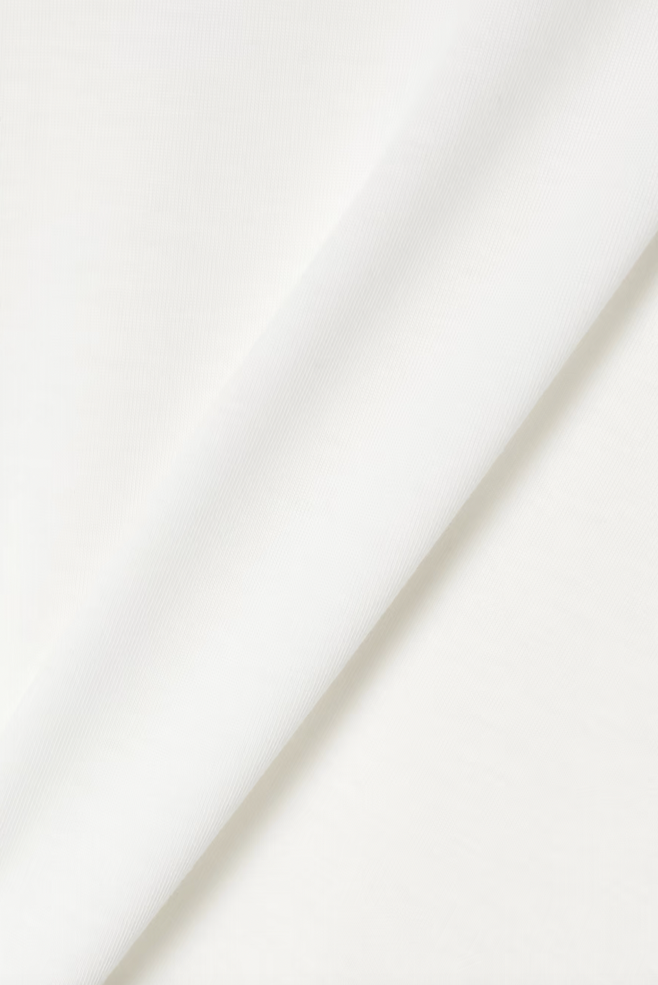 Crafted from premium cotton-jersey, the Ciles T-shirt embodies The Row's philosophy of timeless design and exceptional quality. Its relaxed silhouette offers effortless versatility—pair it with tailored trousers for polished sophistication, tuck it into denim for casual elegance, or layer it under midi skirts for refined dimension. 