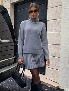 Indulge in luxury with the Margot Knit Blend Set. Elevate your style with this high collar, solid color pullover set for women. The long sleeve combines effortlessly with the elegant casual skirts for a refined and sophisticated look.