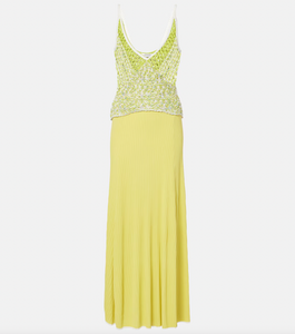 This Lace-trimmed slip dress by Christopher Esber boasts a stunning V-neck collar and delicate sleeveless design. With beautiful crochet panelling, this elegant piece is perfect for any formal occasion. Made from high-quality fabrics, it offers both style and comfort, making you the center of attention.