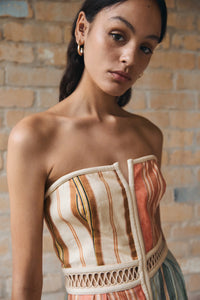 Otherworldly and quintessentially artisanal, the Laude Panelled Midi Dress offers up endless sartorial possibilities. Featuring a hand-drawn print, it’s crafted from fine silk cotton for a refined feel. Honouring the brand’s covetable features, it’s a piece that exudes effortless elegance. Complete with a removable placement belt and button front placket; an ode to adventure and versatility.