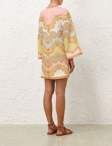 Elevate your resort wardrobe with the Maxine Tunic Mini Dress in Gold Paisley by Zimmermann. Crafted from breathable linen, this dress features a flattering deep V-neckline, stylish wide sleeves, and convenient patch pockets for effortless chic. The center back zip ensures a perfect fit, making it your go-to piece for both relaxed days and elegant evenings.