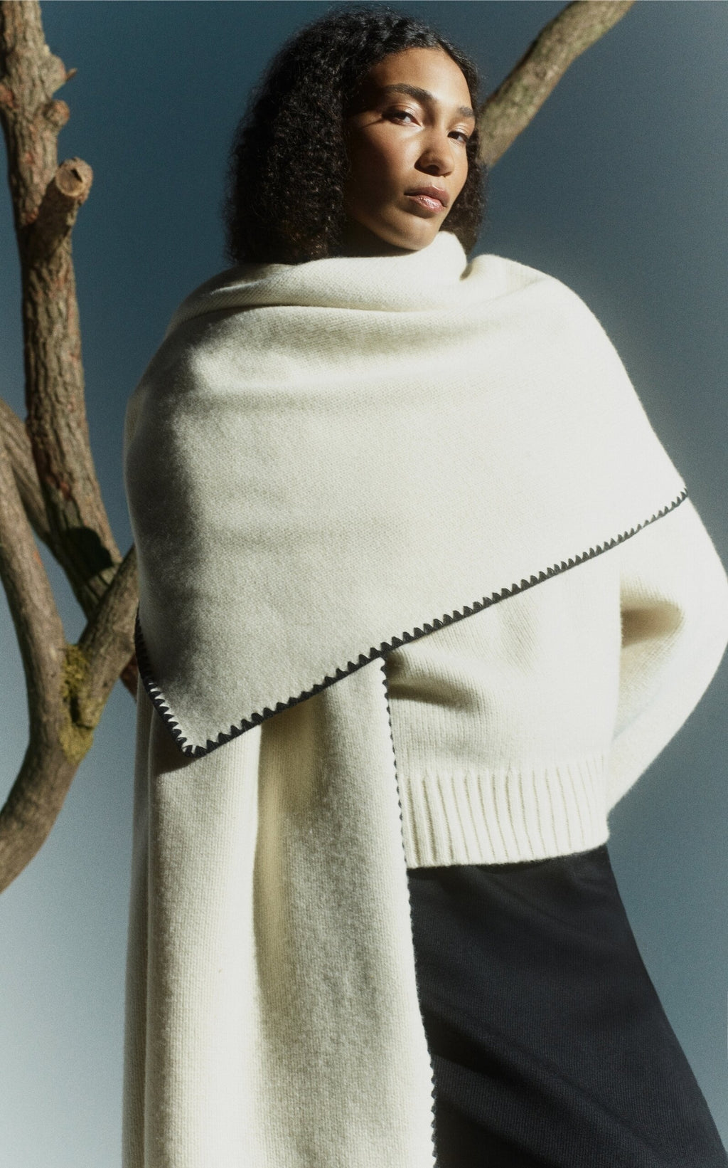Embrace effortless Scandinavian style with this white wool-cashmere sweater by Totême. Crafted in a wide silhouette from mid-weight wool blended with cashmere, it offers cozy warmth and a soft touch. Intricate contrasting embroidery along the shoulders and armholes adds a refined, artisanal detail, elevating your everyday knitwear with subtle sophistication. Perfect for those who appreciate modern minimalism infused with a unique, handcrafted feel.
