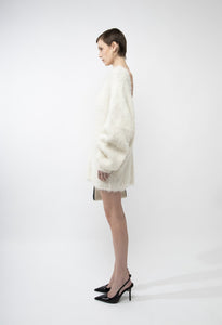 Elevate your wardrobe with the Gemini Sweater, a refined solid knit pullover designed to turn heads. Its daring backless style adds a touch of allure, while the loose fit and round neckline ensure all-day comfort. Long sleeves provide cozy warmth, making it the perfect blend of sophistication and ease. Step out confidently and make a memorable statement with this unique, stylish sweater.