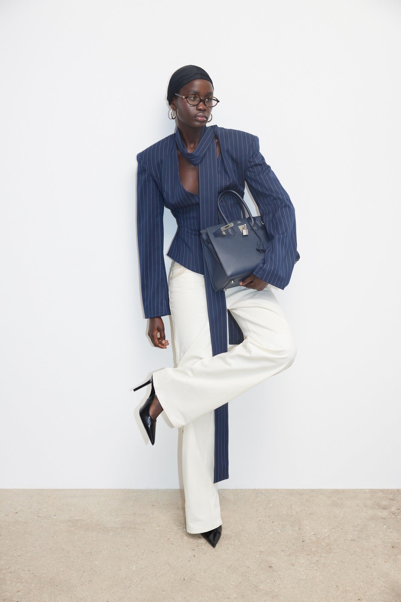 The Charlotte Jacket transforms your everyday style with its striking two-piece polka dot design. This sophisticated set pairs a commanding stand collar jacket with coordinating shorts, delivering effortless elegance for any occasion. Long sleeves and a relaxed silhouette create a polished look that doesn't compromise on comfort, making it ideal for weekend outings or evening plans. The playful dot pattern adds personality to your wardrobe while maintaining versatility across multiple settings. 