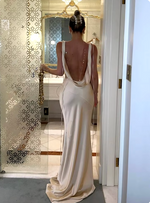 Load image into Gallery viewer, Introducing the Anja Satin Dress - a sleek and elegant sleeveless gown with a pleated V-neck and smooth, open back. The flowing silhouette and refined details make this dress perfect for any upscale event. Elevate your style with the Anja dress.
