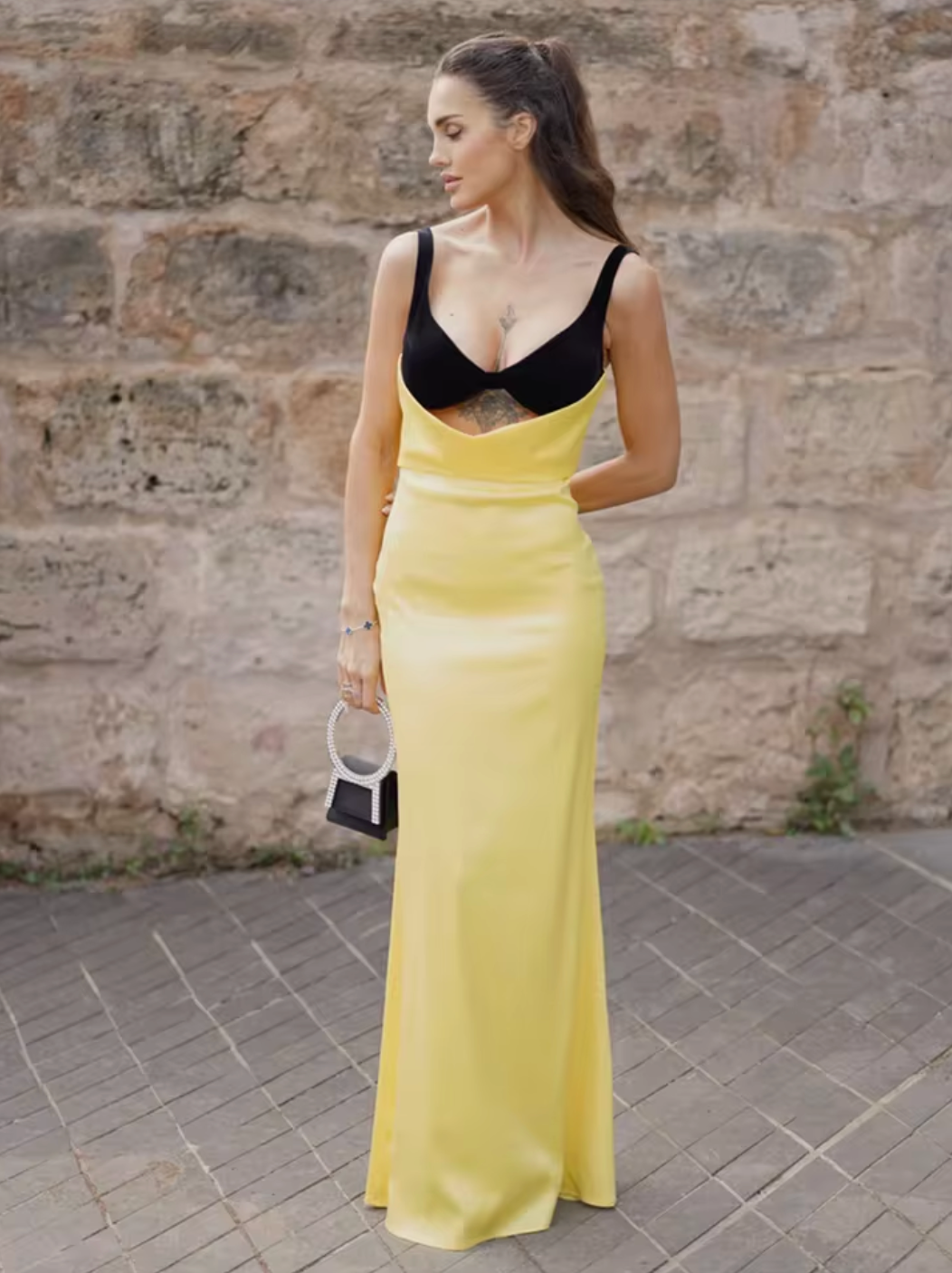 Upgrade your evening wear with Rasario's luxurious draped maxi dress. The silk velvet bodice showcases your décolletage and collarbone, while the crepe satin skirt accentuates your curves. Make an elegant statement with this refined piece, paired with heels and a chic clutch.