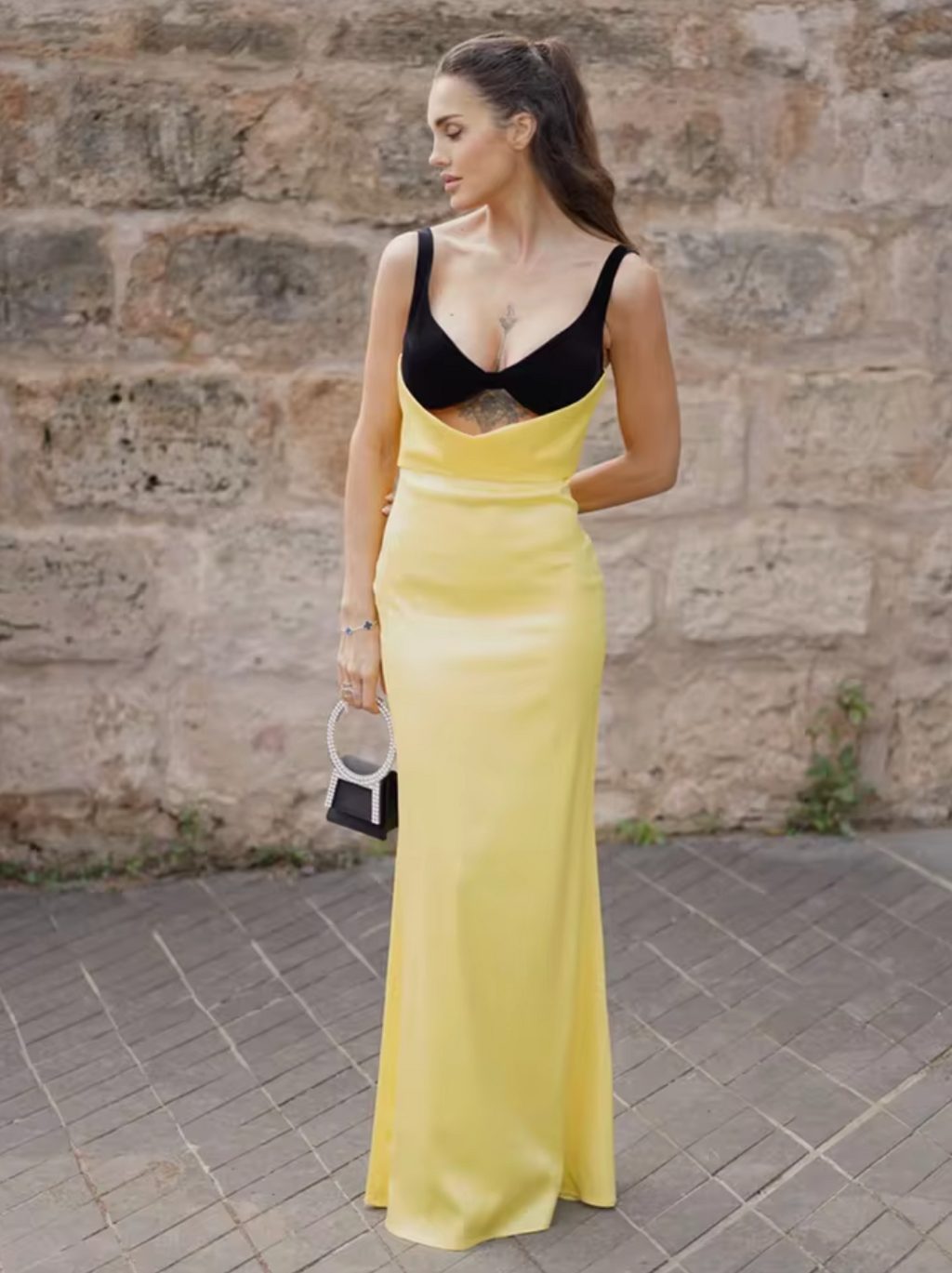 Upgrade your evening wear with Rasario's luxurious draped maxi dress. The silk velvet bodice showcases your décolletage and collarbone, while the crepe satin skirt accentuates your curves. Make an elegant statement with this refined piece, paired with heels and a chic clutch.