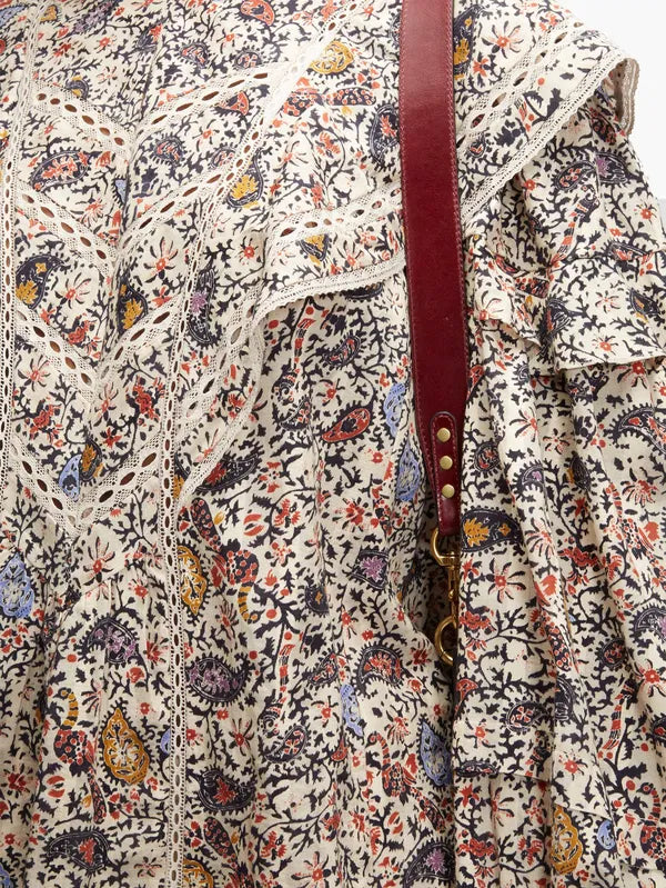 Step into the free-spirited 70s with the Reign Ruffled Paisley-Print Blouse! Adopted by icons like Janis Joplin and Jimi Hendrix, this Isabel Marant Étoile blouse exudes bohemian charm with its multicoloured paisley pattern. Lightweight poplin and delicate lace-trimmed ruffles add a feminine touch. Pair with tailored trousers for a stylish contrast.