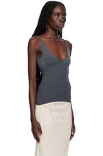 Load image into Gallery viewer, Effortlessly chic and versatile, the Che Tank Top by Paloma Wool features a rib knit cupro fabric for a comfortable and flattering fit. Show off your neckline with the rolled edge plunging V-neck and make a statement with the embroidered logo at the side seam. The fixed shoulder straps ensure a secure and stylish look.
