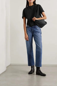 The Fedrino Organic Cotton-jersey T-shirt by The Row offers timeless comfort with a soft, breathable fabric perfect for everyday wear. Its relaxed fit and dropped shoulders provide effortless style, while the slightly wider crewneck adds a modern touch. The subtle back seam enhances the streamlined look, making this tee a versatile staple you’ll turn to season after season. Available in a variety of colors to suit your personal style.