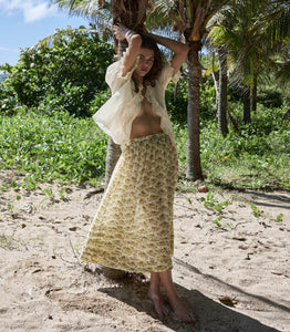 Elevate your wardrobe with the Marcie Skirt in Citron Rosier Floral by Doen, designed for timeless elegance and comfort. Crafted from a soft organic cotton and viscose blend, this high-waisted skirt features a flowing ankle-length silhouette adorned with a vintage-inspired poppy field print. Pintuck details and an invisible side zipper provide a flattering fit, making it a versatile choice for both casual days and special occasions. Experience effortless style with every wear.