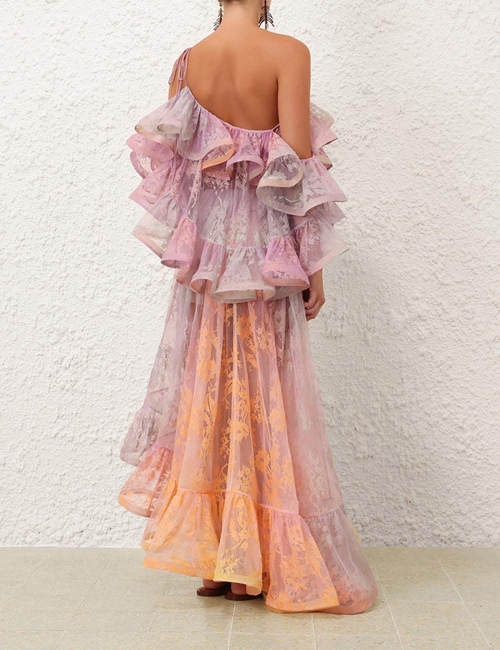 This Dawning Lace Midi Dress by Zimmermann features an elegant one-shoulder neckline with gathered ruffled shoulders and an elasticated finish for a comfortable, secure fit. The concealed side zip creates a seamless silhouette, while the tied waist bow accentuates your figure. Highlighted by a delicate placement print and a flowy hem, this dress effortlessly combines style and grace for any occasion.