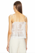 Load image into Gallery viewer, Stay cool and stylish with the Handkerchief Camisole by HELSA. Featuring shoulder strap tie closures and side slits, this cami is made of linen fabric with eyelets and embroidered florals. Its intentionally sheer design allows you to show off your favorite undergarments. Perfect for any occasion, this camisole is a must-have for your wardrobe.
