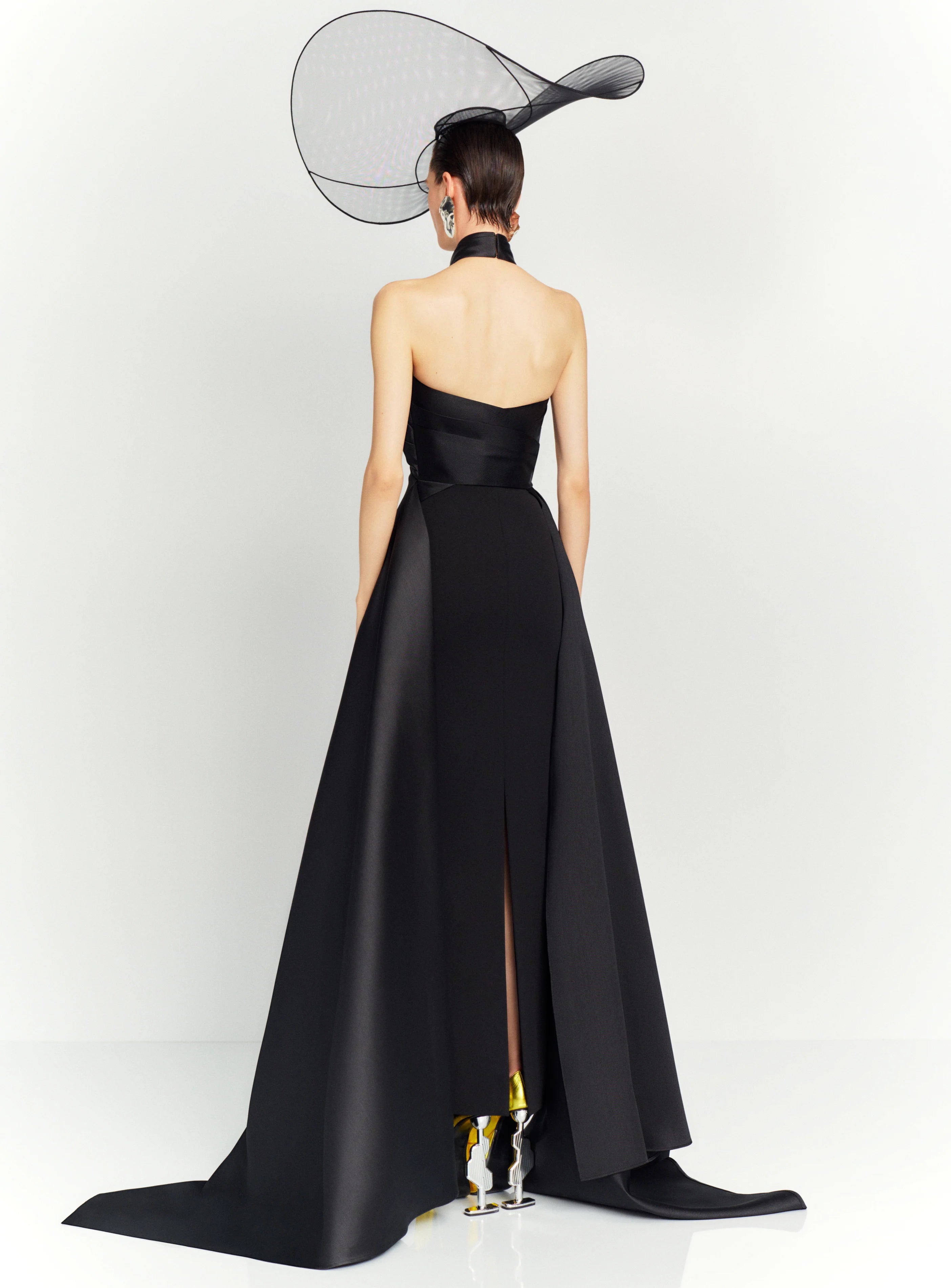 The dramatic silhouette of Solace London's 'Rumi' gown will ensure you'll make a memorable entrance. It's cut from stretch-crepe to hug your figure with glossy satin-twill that wraps around the neck and waist before falling at the sides to an asymmetric hem. Style yours with glittering earrings and elbow-length velvet gloves.