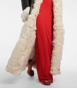 Indulge in luxury with the Magda Butrym Shearling-lined leather coat. Made with premium quality leather and lined with soft shearling, this coat offers both style and comfort. Perfect for chilly winter days, it is a must-have addition to your wardrobe. Elevate your fashion game with this sophisticated and exclusive piece.