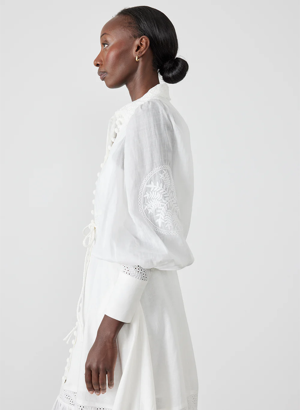 Indulge in luxury with Theodora Embroidery Dress by Joslin. The timeless shirt maxi dress boasts a classic collar and fit for a strong silhouette. The stunning ramie organdy sleeves and skirt hem panel add a touch of sophistication. Perfect for any occasion, elevate your wardrobe with this timeless piece.