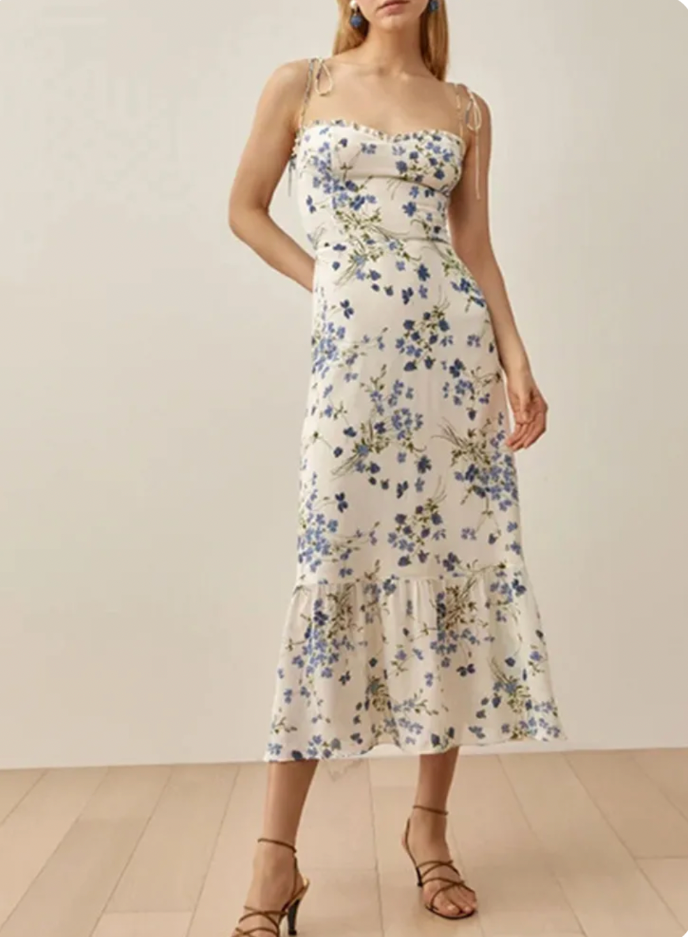 The Enya is a midi length dress with a sweetheart neckline. A smocked back bodice and tie straps with a fitted waist and a full skirt! Very easy to wear and comfortable!!