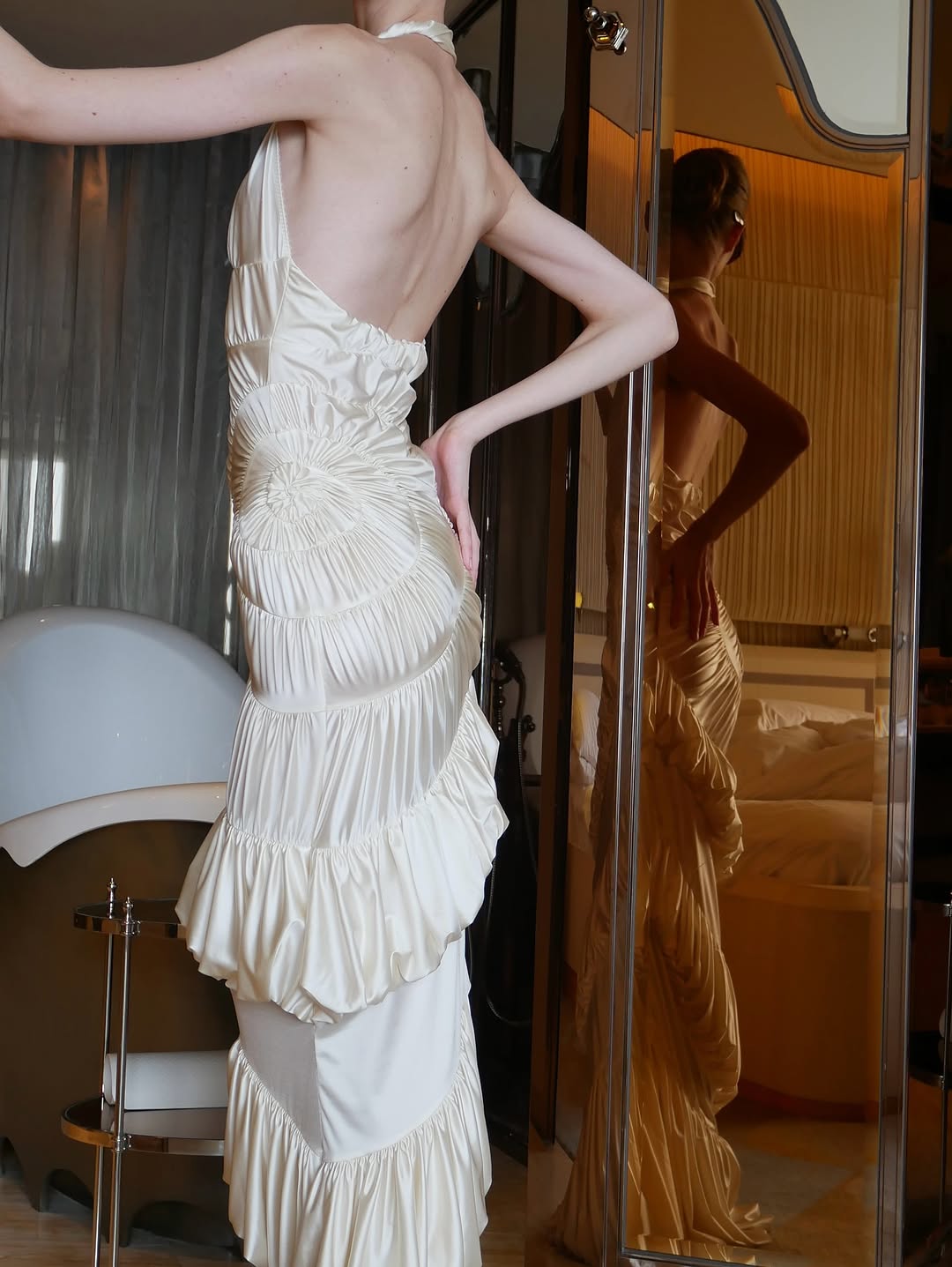 The Ammonite Gown by Datt combines elegance with practical comfort. Crafted from soft mesh that drapes beautifully against your skin, this fitted piece features a convenient side zip for effortless dressing. The included separate bikini lining ensures you're covered and confident underneath, making this gown versatile enough for any occasion where you want to feel polished and put-together.