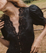 Load image into Gallery viewer, Crafted from lightweight, crisp ramie, the Idella Top from Doen features a plunging V-neckline, short puffed sleeves, and intricate embroidered lace details. Mother-of-pearl buttons adorn the front, while lace insets add delicate touches. This antique-inspired top is perfect for a breezy, feminine look.
