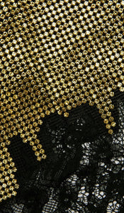 Elevate your evening wardrobe with the Champagne Crystal Set—a dazzling combination of a relaxed-fit chainmail top and a flirtatious mini skirt. The top features champagne crystals, lace-trimmed hem, button-back closure, and full lining for comfort and polish. The matching fitted mini skirt, detailed with delicate lace trim and a back zipper, offers subtle allure with its minimal stretch and unlined finish. 