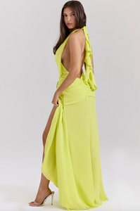 Elevate your style with the Backless Halter Maxi Dress, perfect for special occasions. Made from luxurious Georgette fabric, this dress features a plunging halter neck and silver-tone waist hardware for a touch of elegance. The open back, adorned with spiral frill ties, adds a beautiful detail to this dress.