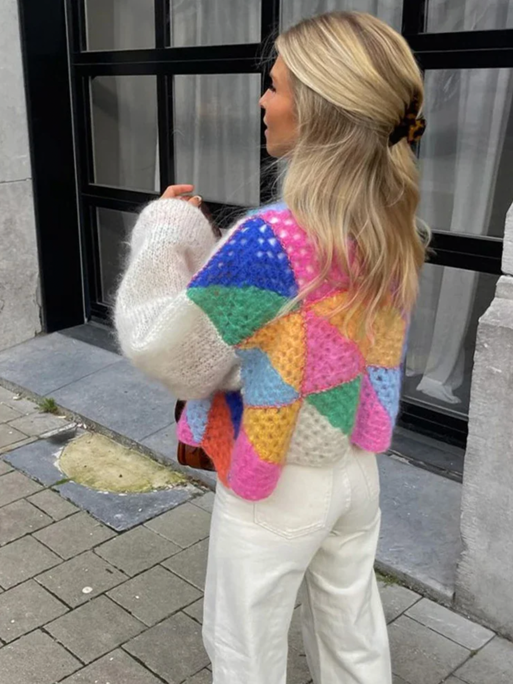 Introducing the Cardigan Sophie, a must-have addition to your wardrobe. This vibrant patchwork design boasts lantern sleeves, O neck, and a loose knitwear fit. Made with high-quality materials and detailed crochet work, this cardigan offers both fashion and comfort. Elevate your style with this chic and versatile piece.