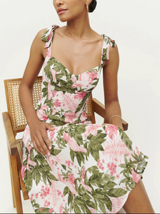 Get ready to turn heads this summer with the Nadira Midi Dress! This stylish beach dress for women features a beautiful floral print that will make you stand out on the shore. Perfect for warm weather, this dress will keep you comfortable and looking chic. Upgrade your summer wardrobe now!