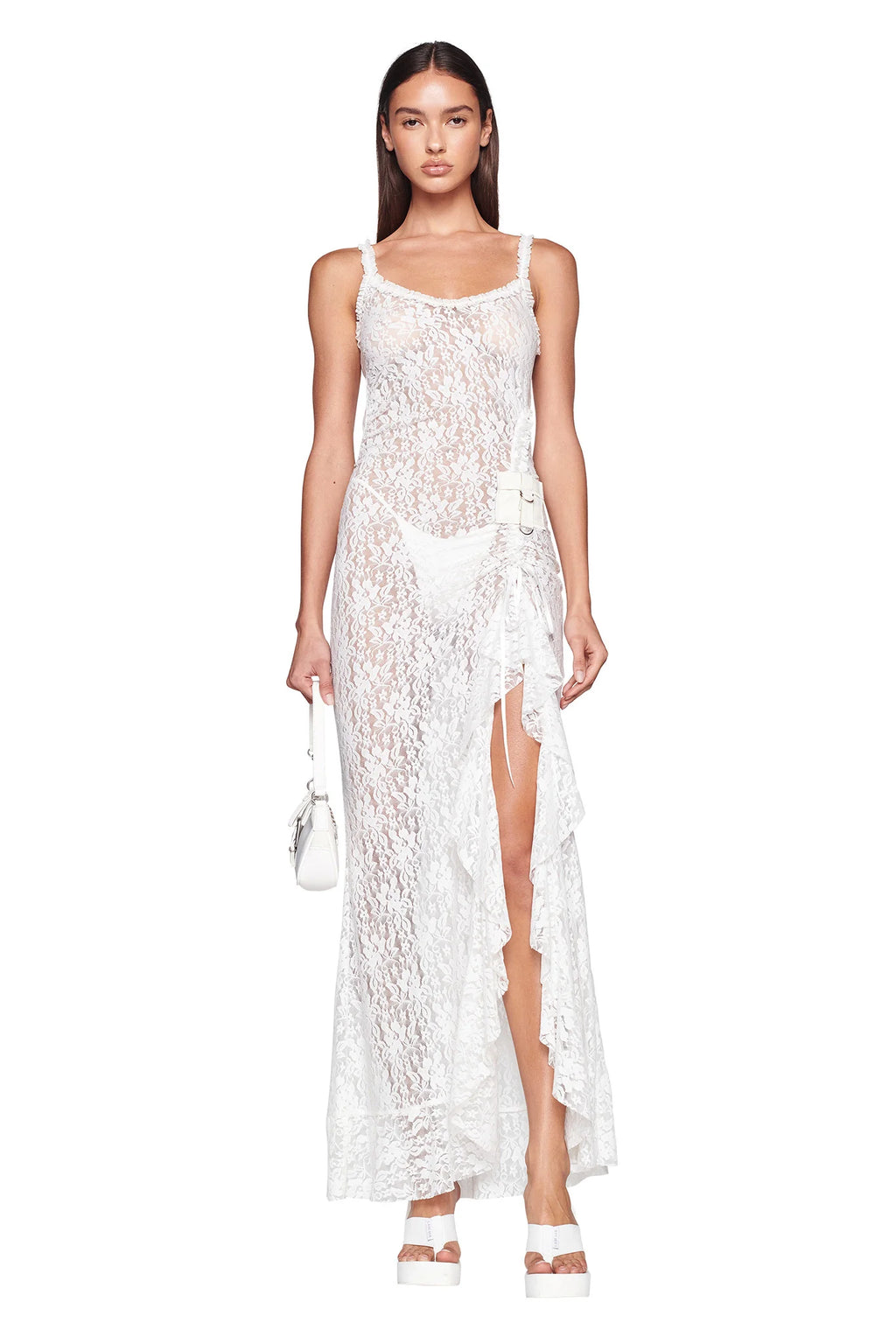 Introducing the Maisie Dress - the epitome of luxury and elegance. Elevate your summer wardrobe with this stunning white lace dress, complete with a thigh-high split, asymmetrical hem, and functional pocket. Its A-line silhouette and adjustable length make it both stylish and comfortable, while the g-string style undergarment and slip-on design add convenience and sophistication.