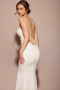 Experience elegance and allure with the expertly-crafted Abella Dress. Its stunning fishtail silhouette, intricate backless detail, and beautiful white lace make it perfect for any bride wanting to make a statement on her special day. Turn heads and feel confident in this timeless and elegant dress.