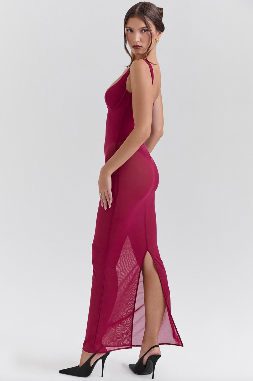 Indulge in luxury with the Robina Maxi Dress. This enchanting dress exudes elegance and allure in a rich Wine hue. The mesh design hugs your body, making every entrance unforgettable. Elevate your style and captivate all with this show-stopping piece.