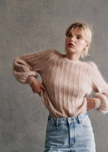 Stay cozy and chic in the Aretha Jumper. Made from a luxurious blend of wool and kid mohair, this jumper features long puffed sleeves and a boat neckline for a stylish and comfortable fit. The patterned knit adds a touch of texture, making it the perfect addition to your fall and winter wardrobe.