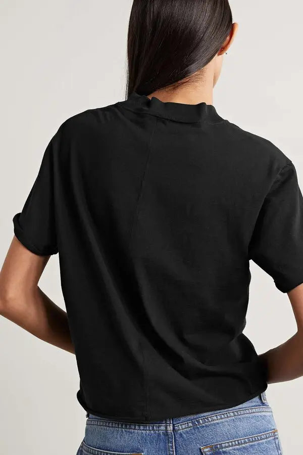 The Fedrino Organic Cotton-jersey T-shirt by The Row offers timeless comfort with a soft, breathable fabric perfect for everyday wear. Its relaxed fit and dropped shoulders provide effortless style, while the slightly wider crewneck adds a modern touch. The subtle back seam enhances the streamlined look, making this tee a versatile staple you’ll turn to season after season. Available in a variety of colors to suit your personal style.
