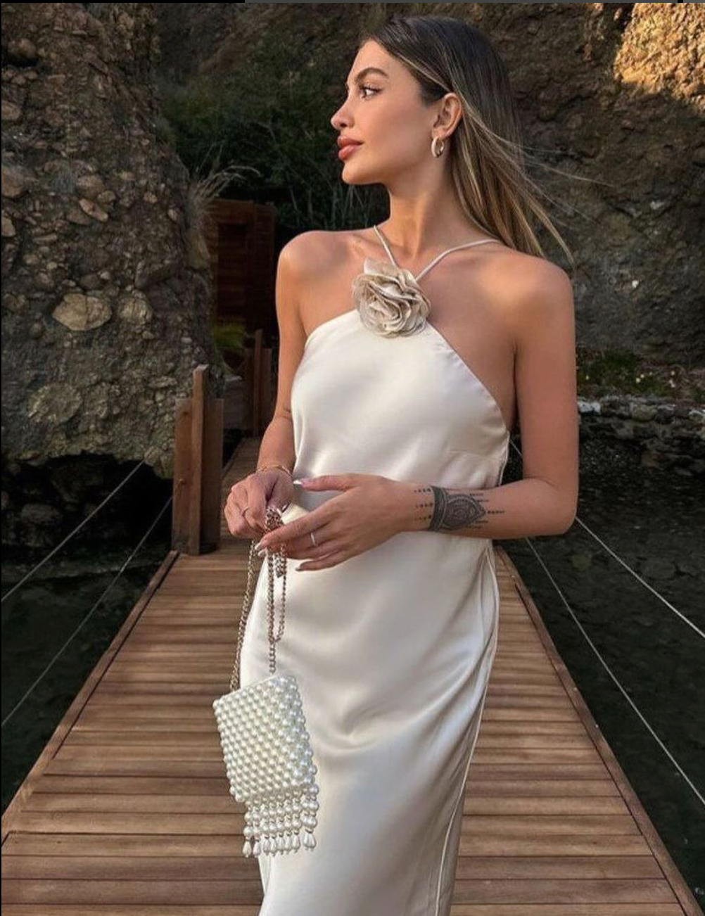 Get ready to turn heads at your next event with the Riva Dress. Made from luxurious cocktail satin silk, this elegant dress exudes sophistication and style. Perfect for any occasion, it will make you feel confident and glamorous. Elevate your wardrobe with this must-have piece.