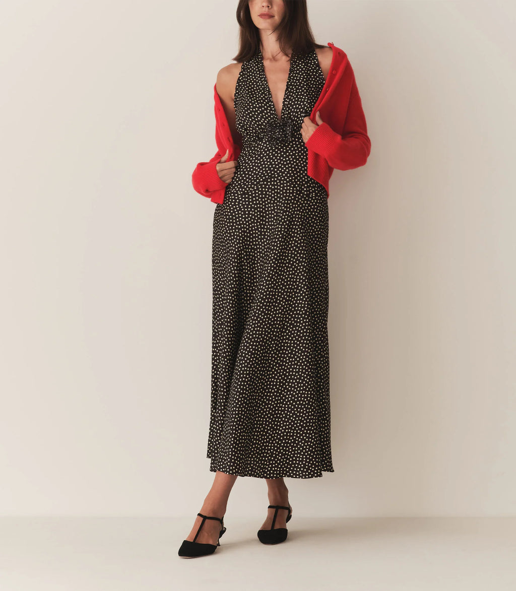 The Mazarin Dress - Camille Dot by Doen captures subtle 1990s sophistication through its luxurious silk-viscose blend and elegant halter neckline accented with fine ruffles. Designed with a fitted bodice and an invisible side zipper, it ensures a smooth, tailored silhouette. A removable silk georgette rosette brooch adds an element of adaptable refinement, perfect for elevating your wardrobe with timeless grace.