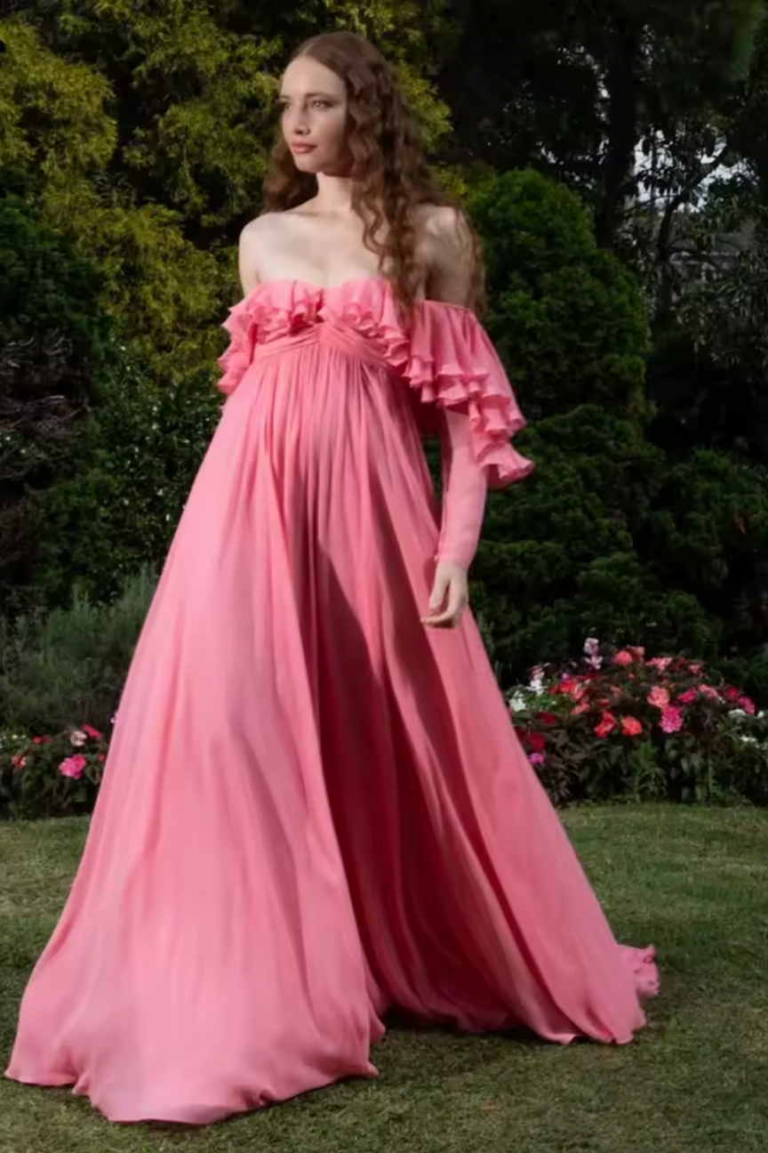 Get ready for a dreamy summer with this Off-shoulder Silk Georgette Gown from Giambattista Valli. Made with luxurious silk georgette, the fluid drape and flirty ruffle detail exude a romantic charm. Perfect for any special occasion, this exclusive gown will make you feel like a beautiful rosebud.