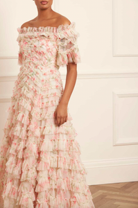 Indulge in the whimsical beauty of the Lana Off-Shoulder Gown. A hand-painted print of sunset and pink peonies adorns this signature Needle &amp; Thread style, while gathered frills add a romantic touch. The off-shoulder design with elasticated panels and layers of soft tulle creates a statement look. Plus, an internal corset with stretch power mesh ensures comfort and perfect fit.