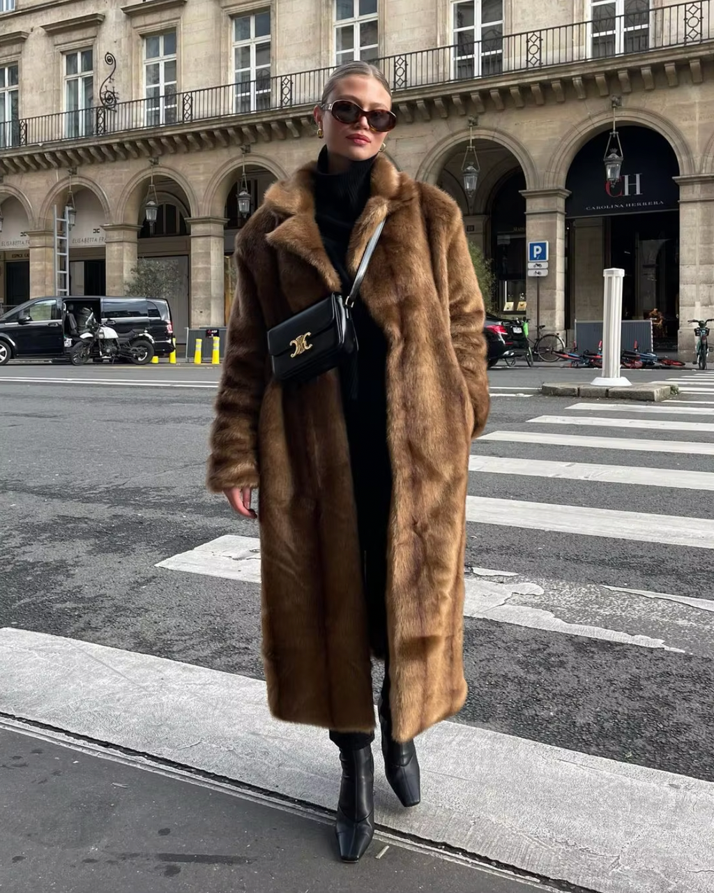 Indulge in luxury with our Bruna Shearling Coat. This fur-inspired masterpiece effortlessly combines textures and patterns for a bold, sophisticated look. The camel-colored faux fur coat adds warmth and opulence to any outfit. Upgrade your wardrobe with this statement piece.