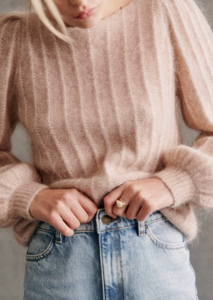 Stay cozy and chic in the Aretha Jumper. Made from a luxurious blend of wool and kid mohair, this jumper features long puffed sleeves and a boat neckline for a stylish and comfortable fit. The patterned knit adds a touch of texture, making it the perfect addition to your fall and winter wardrobe.