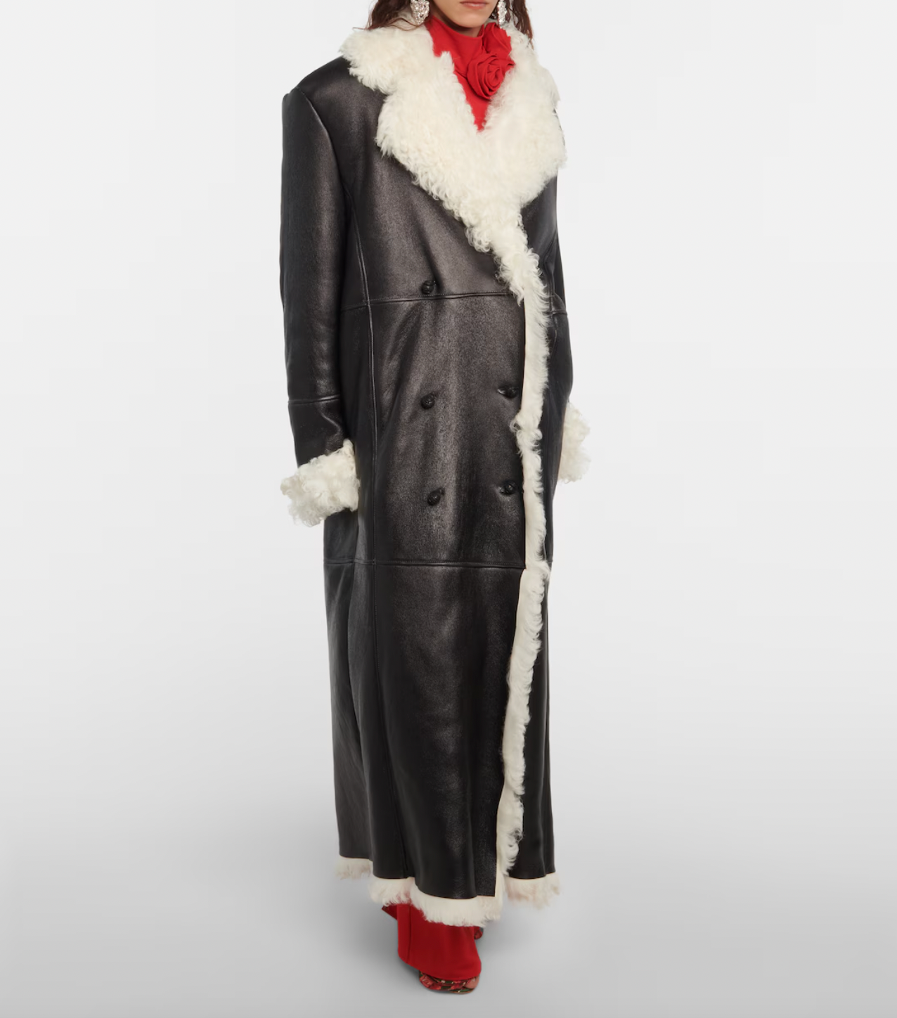 Indulge in luxury with the Magda Butrym Shearling-lined leather coat. Made with premium quality leather and lined with soft shearling, this coat offers both style and comfort. Perfect for chilly winter days, it is a must-have addition to your wardrobe. Elevate your fashion game with this sophisticated and exclusive piece.