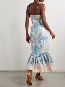 Elevate your elegance with Zimmermann's Illuminate gown, crafted from a luxurious linen and silk blend adorned with vibrant paisley swirls. This stunning dress features intricate bead embellishments along the sweetheart neckline, straps, and ruffled mermaid hem, adding a sparkling touch to your look. Designed with padded, underwired cups, it offers gentle support while enhancing your silhouette. 