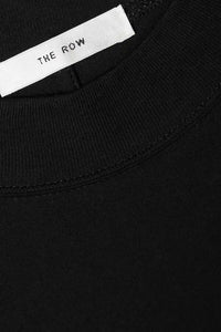 The Fedrino Organic Cotton-jersey T-shirt by The Row offers timeless comfort with a soft, breathable fabric perfect for everyday wear. Its relaxed fit and dropped shoulders provide effortless style, while the slightly wider crewneck adds a modern touch. The subtle back seam enhances the streamlined look, making this tee a versatile staple you’ll turn to season after season. Available in a variety of colors to suit your personal style.