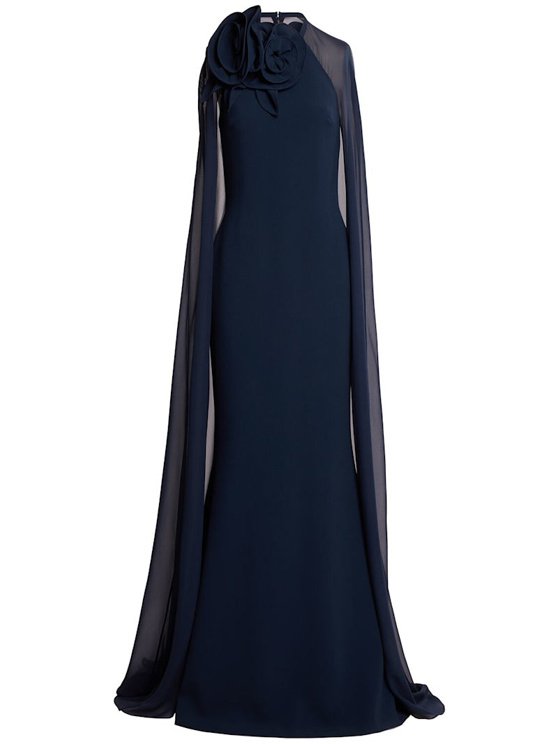 The silk blend long dress by Elie Saab features a non-detachable sheer cape that adds an elegant touch to your look. The beautiful flower appliqués at the neckline give this dress a unique and feminine vibe, perfect for that special occasion. Made of a high-quality silk in a flattering navy color, this dress is available in a range of sizes to suit every body type.