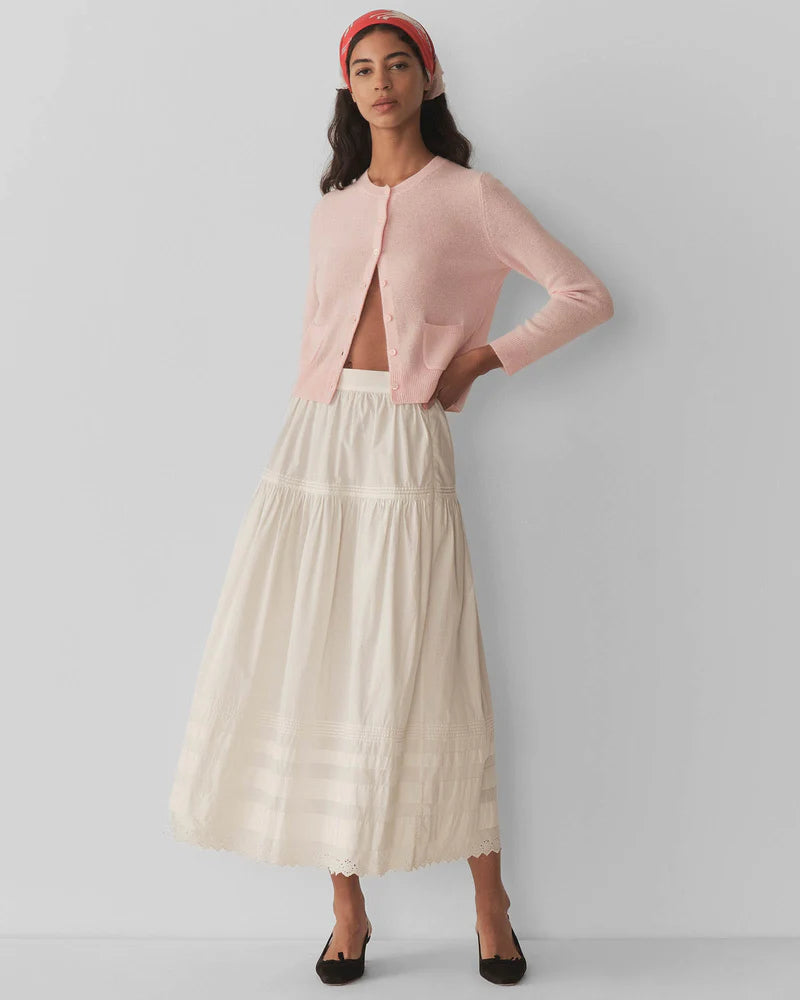 Embrace timeless elegance with the Freya Cardigan by Doen, a luxurious piece that channels 1960s sophistication. Crafted from sumptuous 100% cashmere, this fitted cardigan features a classic crew neck and bracelet-length sleeves that flatter every frame. Mother-of-pearl buttons add an understated touch of refinement, while the tailored silhouette ensures effortless polish for any occasion. 