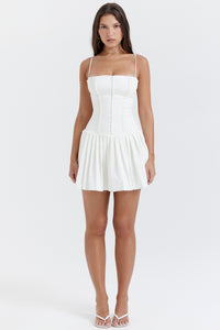 Add some summer fun to your wardrobe with "Marcy"! This mini A-line dress features a playful pleated skirt and a ruched bodice, making it perfect for birthday parties, vacations, and nights out. Its zippered back and full lining ensure comfort, while the "Lola" white heels add a touch of elegance. Cheers to sunny days!