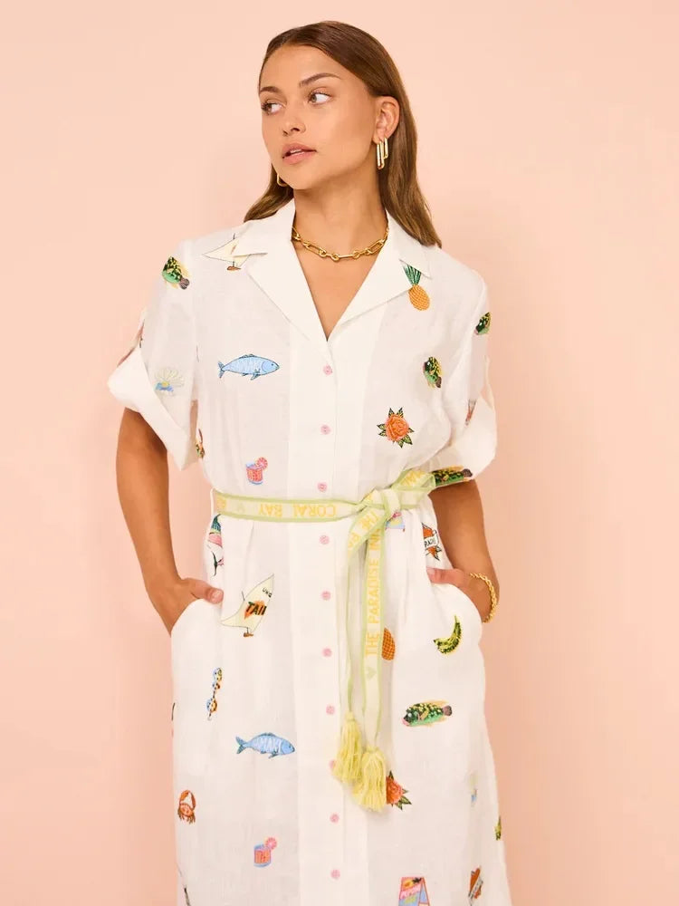 Indulge in luxury with our Blue Marlin linen shirt dress. Made from premium cream white linen with a beautiful multicolour slub texture and all-over motif embroidery, this dress exudes sophistication. Complete with a Cuban collar, short rolled sleeves, and a detachable logo-jacquard belt, it's designed to accentuate your figure with a fitted waistline and flared silhouette. Don't forget the practicality with two side inset pockets and belt loops. Elevate your wardrobe today.