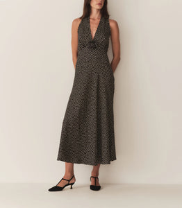 The Mazarin Dress - Camille Dot by Doen captures subtle 1990s sophistication through its luxurious silk-viscose blend and elegant halter neckline accented with fine ruffles. Designed with a fitted bodice and an invisible side zipper, it ensures a smooth, tailored silhouette. A removable silk georgette rosette brooch adds an element of adaptable refinement, perfect for elevating your wardrobe with timeless grace.